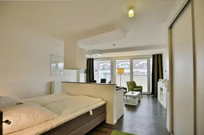 Ein Bett oder Betten in einem Zimmer der Unterkunft Duhner Strandhus, S306