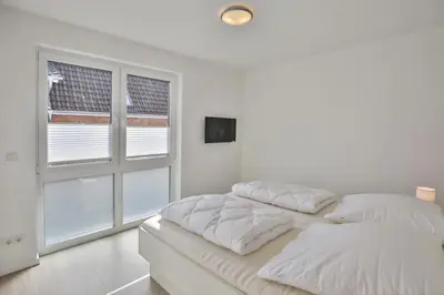 Ein Bett oder Betten in einem Zimmer der Unterkunft Meine See, MS5