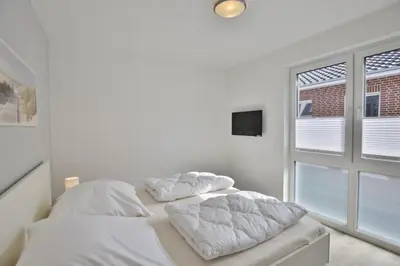 Ein Bett oder Betten in einem Zimmer der Unterkunft Meine See, MS5