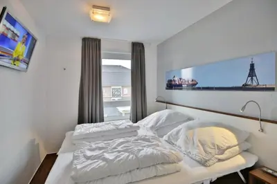 Ein Bett oder Betten in einem Zimmer der Unterkunft Rugenbarg, RR5