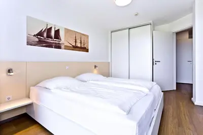 Ein Bett oder Betten in einem Zimmer der Unterkunft Alte Liebe, RA104