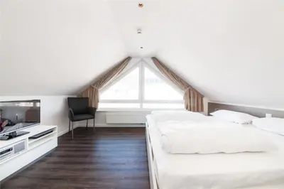 Ein Bett oder Betten in einem Zimmer der Unterkunft Duhner Brandung, B8