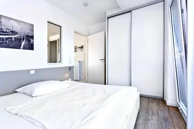 Ein Bett oder Betten in einem Zimmer der Unterkunft Duhner Brandung, B12