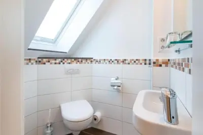 Ein Badezimmer in der Unterkunft Wattwagen, RW5