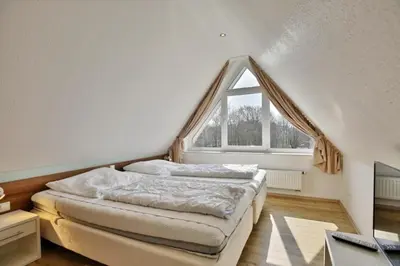 Ein Bett oder Betten in einem Zimmer der Unterkunft Wattwagen, RW5