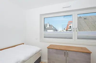 Ein Bett oder Betten in einem Zimmer der Unterkunft Nordstrand, N202a