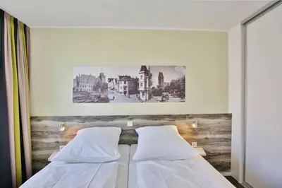 Ein Bett oder Betten in einem Zimmer der Unterkunft Duhner Strandhus, S208