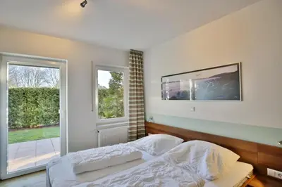 Ein Bett oder Betten in einem Zimmer der Unterkunft Wattwagen, RW2