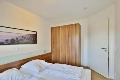 Ein Bett oder Betten in einem Zimmer der Unterkunft Wattwagen, RW2