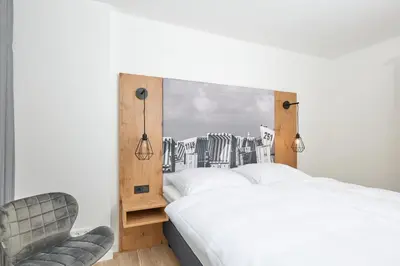 Ein Bett oder Betten in einem Zimmer der Unterkunft Nordstrand, N104