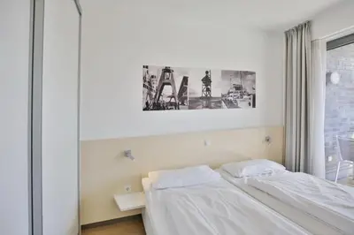 Ein Bett oder Betten in einem Zimmer der Unterkunft Alte Liebe, RA207
