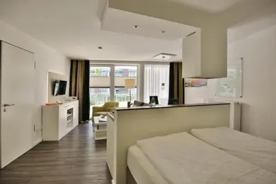 Ein Bett oder Betten in einem Zimmer der Unterkunft Duhner Strandhus, S8