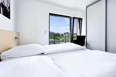 Ein Bett oder Betten in einem Zimmer der Unterkunft Alte Liebe, RA208