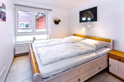 Ein Bett oder Betten in einem Zimmer der Unterkunft Rugenbarg, RR6