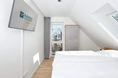 Ein Bett oder Betten in einem Zimmer der Unterkunft Nordstrand, N301a