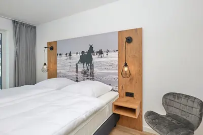 Ein Bett oder Betten in einem Zimmer der Unterkunft Nordstrand, N203