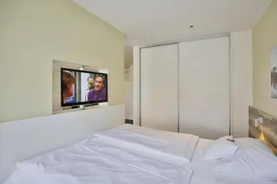 Ein Bett oder Betten in einem Zimmer der Unterkunft Duhner Strandhus, S4