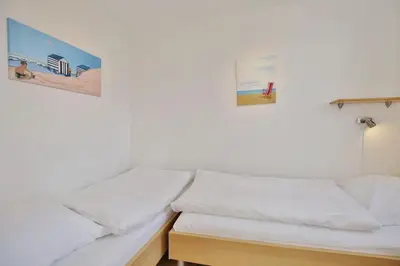 Ein Bett oder Betten in einem Zimmer der Unterkunft Hohe Worth, H312