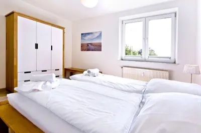 Ein Bett oder Betten in einem Zimmer der Unterkunft Seeterrassen, ST13