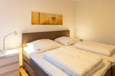 Ein Bett oder Betten in einem Zimmer der Unterkunft Stranddüne, D13