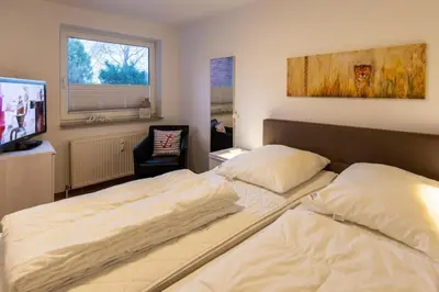 Ein Bett oder Betten in einem Zimmer der Unterkunft Stranddüne, D13
