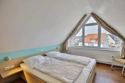 Ein Bett oder Betten in einem Zimmer der Unterkunft Wattwagen, RW6