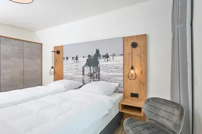 Ein Bett oder Betten in einem Zimmer der Unterkunft Nordstrand, N101