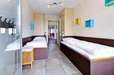 Ein Bett oder Betten in einem Zimmer der Unterkunft Residenz am Yachthafen, RY21