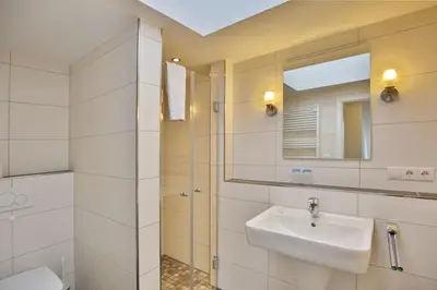 Ein Badezimmer in der Unterkunft Admiralsgarten, AG17b