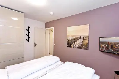 Ein Bett oder Betten in einem Zimmer der Unterkunft Seemöwe, SM4