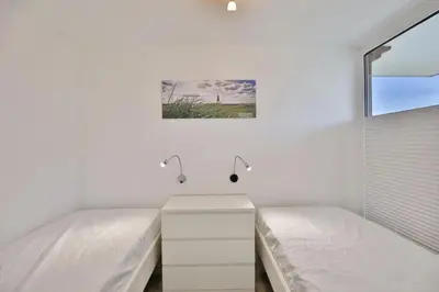 Ein Bett oder Betten in einem Zimmer der Unterkunft Hohe Worth, H301