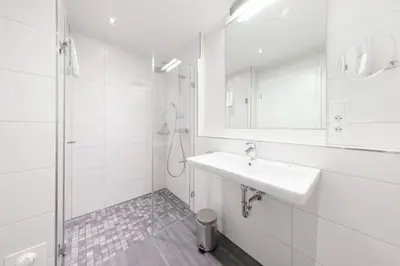 Ein Badezimmer in der Unterkunft Admiralsgarten, AG5s