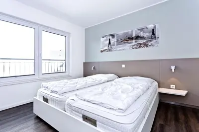Ein Bett oder Betten in einem Zimmer der Unterkunft Duhner Brandung, B7