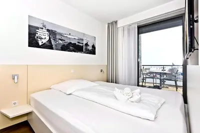 Ein Bett oder Betten in einem Zimmer der Unterkunft Alte Liebe, RA307