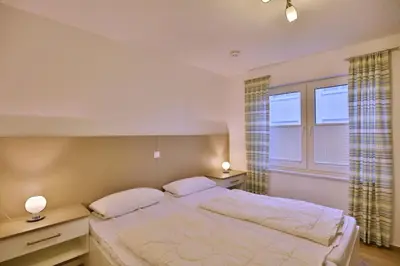 Ein Bett oder Betten in einem Zimmer der Unterkunft Admiralsgarten, AG6b