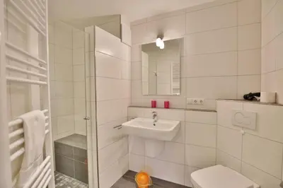 Ein Badezimmer in der Unterkunft Admiralsgarten, AG6b