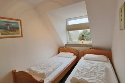 Ein Bett oder Betten in einem Zimmer der Unterkunft Stranddüne, D16