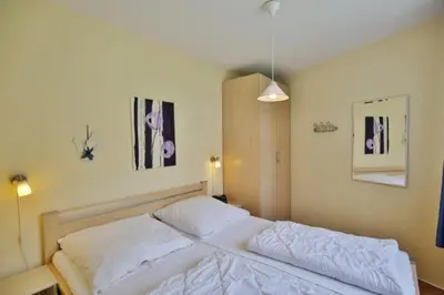 Ein Bett oder Betten in einem Zimmer der Unterkunft Seemöwe, SM6