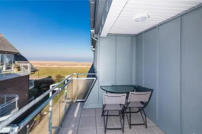 Ein Balkon oder eine Terrasse in der Unterkunft Dünenweg 37, DW5
