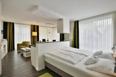 Ein Bett oder Betten in einem Zimmer der Unterkunft Duhner Strandhus, S2