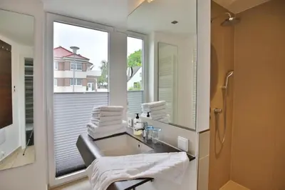 Ein Badezimmer in der Unterkunft Duhner Strandhus, S2
