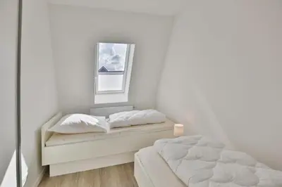 Ein Bett oder Betten in einem Zimmer der Unterkunft Meine See, MS9