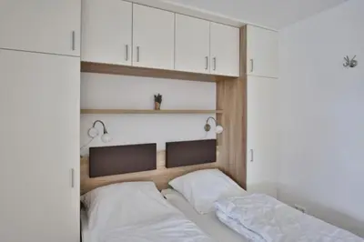 Ein Bett oder Betten in einem Zimmer der Unterkunft Rugenbarg, RR16