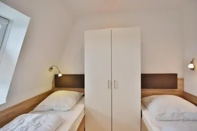 Ein Bett oder Betten in einem Zimmer der Unterkunft Rugenbarg, RR16