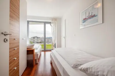 Ein Bett oder Betten in einem Zimmer der Unterkunft Residenz am Yachthafen, RY27