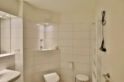 Ein Badezimmer in der Unterkunft Hohe Worth, H209