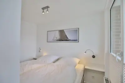 Ein Bett oder Betten in einem Zimmer der Unterkunft Hohe Worth, H209