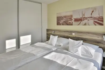 Ein Bett oder Betten in einem Zimmer der Unterkunft Duhner Strandhus, S13