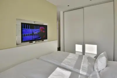 Ein Bett oder Betten in einem Zimmer der Unterkunft Duhner Strandhus, S13