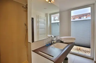 Ein Badezimmer in der Unterkunft Duhner Strandhus, S13